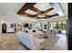 Spacious living area with an open layout, modern furniture, and access to the outdoor pool area at 1517 Edenhall Pt, Lake Mary, FL 32746