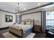Spacious main bedroom with decorative lighting, wood floors, and a luxurious feel at 1517 Edenhall Pt, Lake Mary, FL 32746