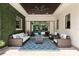 Inviting outdoor living space with comfortable seating, ceiling fan, and views of the pool area at 1517 Edenhall Pt, Lake Mary, FL 32746