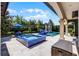 Luxury pool with waterfall feature, sun loungers, and lush landscaping at 1517 Edenhall Pt, Lake Mary, FL 32746