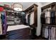 Generous walk-in closet with lots of shelving and hanging space for ultimate organization at 1517 Edenhall Pt, Lake Mary, FL 32746