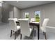 Bright dining room with large windows and seating for six, perfect for Gathering meals at 1856 Archer Dr, Minneola, FL 34715