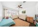 Charming bedroom with a crib, twin bed, and neutral-toned decor, perfect for a Bedroom or room at 2102 Ivanhoe Rd, Orlando, FL 32804