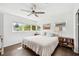 Bright bedroom with hardwood floors, ceiling fan, and ample natural light at 2102 Ivanhoe Rd, Orlando, FL 32804