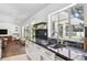 Bright kitchen featuring granite countertops, stainless steel appliances, and abundant natural light at 2102 Ivanhoe Rd, Orlando, FL 32804