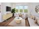 Inviting living room with stylish furniture, a large window, and modern decor at 2272 Hen Rd, Minneola, FL 34715