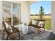 Relaxing outdoor patio with stylish seating and a view of the backyard at 2272 Hen Rd, Minneola, FL 34715