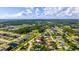 A neighborhood aerial view showcases lush greenery and well-spaced homes at 2356 Date Palm Dr, Edgewater, FL 32141