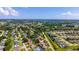A neighborhood aerial view showcases lush greenery and well-spaced homes at 2356 Date Palm Dr, Edgewater, FL 32141