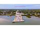Aerial view of George R. Kennedy Memorial Park featuring waterfront access, piers, parking, green spaces and street views at 2356 Date Palm Dr, Edgewater, FL 32141