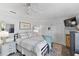 Bright bedroom features a bed with a patterned rug, creating a serene atmosphere at 2356 Date Palm Dr, Edgewater, FL 32141