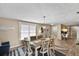 Inviting dining room featuring stylish furniture and decor, illuminated by a modern chandelier at 2356 Date Palm Dr, Edgewater, FL 32141