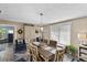 Cozy dining room featuring a wooden table, stylish chairs, and charming nautical-themed decor at 2356 Date Palm Dr, Edgewater, FL 32141