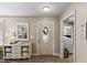 Welcoming entryway featuring stylish decor, including a mirror, console table, and tiled flooring at 2356 Date Palm Dr, Edgewater, FL 32141