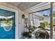 Charming front porch entrance showcases a welcoming atmosphere, enhanced by decor and a comfortable seating area at 2356 Date Palm Dr, Edgewater, FL 32141