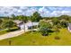 Charming single-story home with a well-manicured lawn and palm trees at 2356 Date Palm Dr, Edgewater, FL 32141