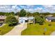 Charming single-story home with a well-manicured lawn and palm trees at 2356 Date Palm Dr, Edgewater, FL 32141