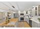 Updated kitchen boasts stainless steel appliances, sleek countertops, and custom cabinetry at 2356 Date Palm Dr, Edgewater, FL 32141