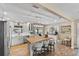 Bright, remodeled kitchen features a center island, modern appliances, custom cabinets and beautiful flooring at 2356 Date Palm Dr, Edgewater, FL 32141