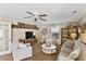 Inviting living room features neutral paint, a ceiling fan, and comfortable seating, creating a cozy atmosphere at 2356 Date Palm Dr, Edgewater, FL 32141
