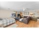 Inviting living area featuring a comfortable sofa, entertainment setup, and sleeping area in the background at 2356 Date Palm Dr, Edgewater, FL 32141