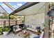 Charming covered patio is perfect for outdoor relaxation, featuring comfortable seating and tasteful decor at 2356 Date Palm Dr, Edgewater, FL 32141