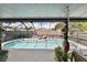 Relaxing screened-in pool with lounge chairs and tropical plants at 2356 Date Palm Dr, Edgewater, FL 32141
