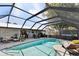 Enclosed pool with room for chairs at 2356 Date Palm Dr, Edgewater, FL 32141