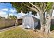 Backyard features a useful shed with double doors and bonus carport storage at 2356 Date Palm Dr, Edgewater, FL 32141