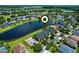 Aerial view of a lakeside property showcasing lush greenery and serene water views at 2451 Ridgemoor Dr, Orlando, FL 32828