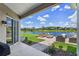 Backyard patio with lake view and a custom fire pit at 2451 Ridgemoor Dr, Orlando, FL 32828