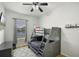 Shared bedroom with a gray bunk bed, soft rug, and water view, ideal for siblings at 2451 Ridgemoor Dr, Orlando, FL 32828