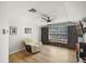 Bright bonus room featuring a window bench, built in cabinets, and a ceiling fan at 2451 Ridgemoor Dr, Orlando, FL 32828