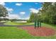 Outdoor exercise area by a path and lake offers a scenic workout experience at 2451 Ridgemoor Dr, Orlando, FL 32828
