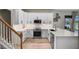 Bright and airy kitchen featuring white cabinets, modern appliances, and sleek countertops at 2451 Ridgemoor Dr, Orlando, FL 32828