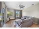 Comfortable living room with a plush sectional sofa, scenic water view, and modern media center at 2451 Ridgemoor Dr, Orlando, FL 32828