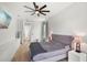 Calming main bedroom with neutral tones, wood floors, and a ceiling fan at 2451 Ridgemoor Dr, Orlando, FL 32828