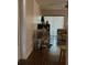Hallway features lovely laminated wood floor, a ceiling fan, and access to the living areas at 2932 Silver Ridge Dr, Orlando, FL 32818