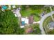 Aerial view featuring a pool, shed, and cars parked outside this charming single-Gathering home at 316 Amanda Ln, Leesburg, FL 34748
