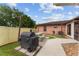 Outdoor patio with a covered grill and dining area, perfect for summer barbecues at 316 Amanda Ln, Leesburg, FL 34748
