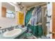 Bathroom featuring a patterned sink, vanity lighting fixture, and unique shower curtain at 316 Amanda Ln, Leesburg, FL 34748