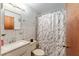 Bathroom with modern fixtures, including a stylish vanity and marble shower curtain at 316 Amanda Ln, Leesburg, FL 34748