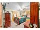 Comfortable bedroom featuring a ceiling fan, decorative wall art, and warm lighting at 316 Amanda Ln, Leesburg, FL 34748