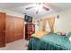 Bedroom featuring a dresser with a TV, neutral walls, closet, and comfortable bed at 316 Amanda Ln, Leesburg, FL 34748
