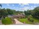 Charming single story home with a well-manicured front lawn and tropical landscaping at 316 Amanda Ln, Leesburg, FL 34748