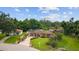 Charming single story home with a well-manicured front lawn and tropical landscaping at 316 Amanda Ln, Leesburg, FL 34748