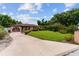 Beautiful single-story home with a well-maintained lawn and charming landscaping, enhancing its curb appeal at 316 Amanda Ln, Leesburg, FL 34748