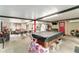 Versatile game room with a pool table, seating area, outdoor access, and entertainment possibilities at 316 Amanda Ln, Leesburg, FL 34748