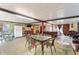 Open game room featuring a dining area, pool table, and access to outdoor seating at 316 Amanda Ln, Leesburg, FL 34748