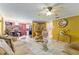 Bright living room featuring tile flooring, ceiling fan, and decorative accents at 316 Amanda Ln, Leesburg, FL 34748